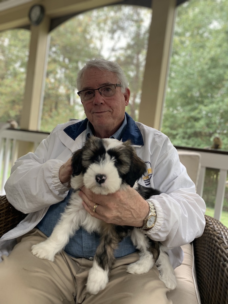 Folly as a puppy with my Dad